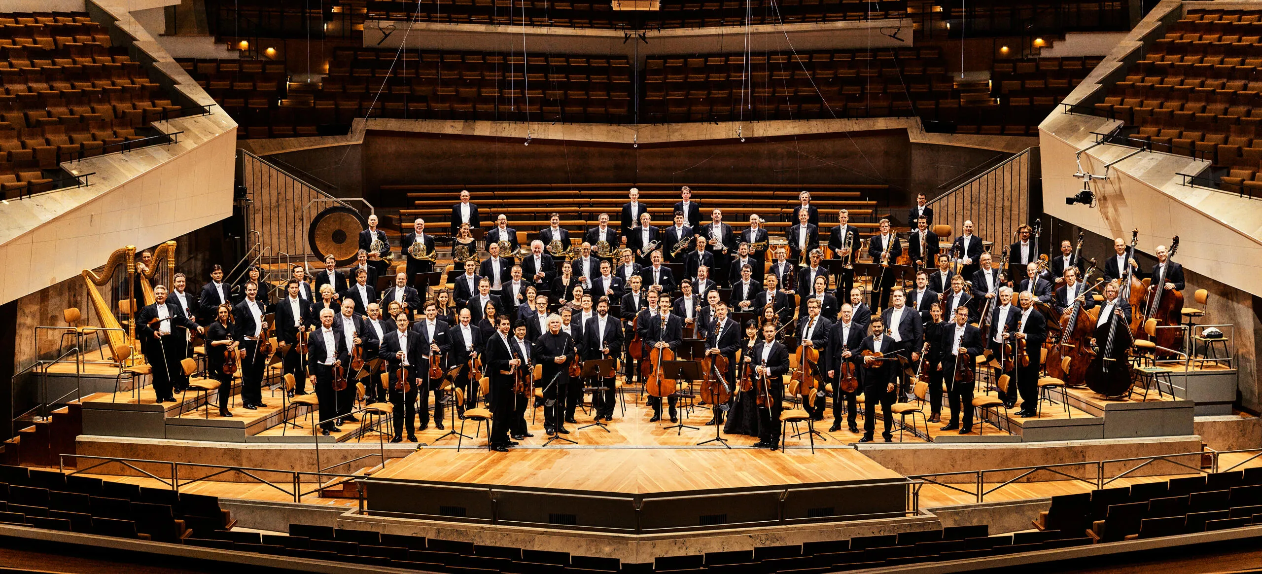 The Berliner Philharmoniker orchestra on stage in the Philharmonie Berlin.