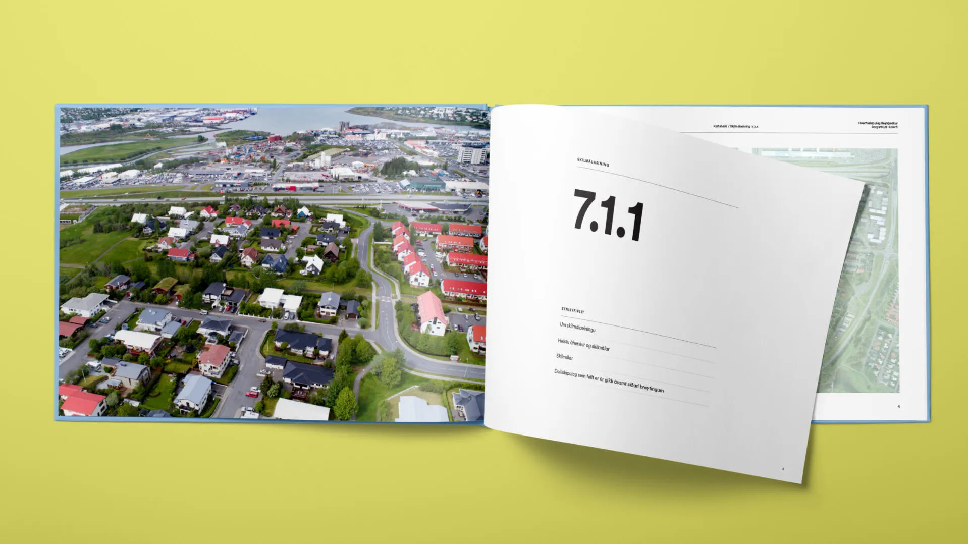 Planning book spread with an aerial photo of a neighbourhood and chapter 7.1.1.
